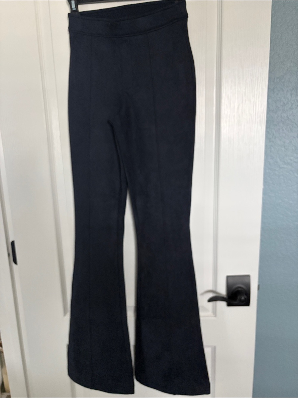 SPANX Black Garment with Red Logo Tab